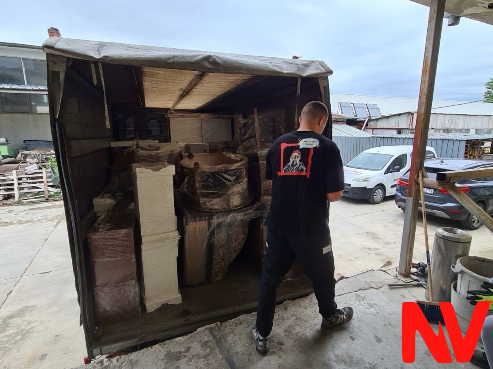 NV mover loading packed furniture into the van during a move in Plovdiv
